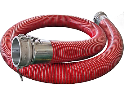 Red industrial composite hose with metal camlock fittings.