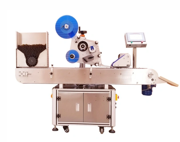 Industrial automatic labeling machine on conveyor with control screen system.
